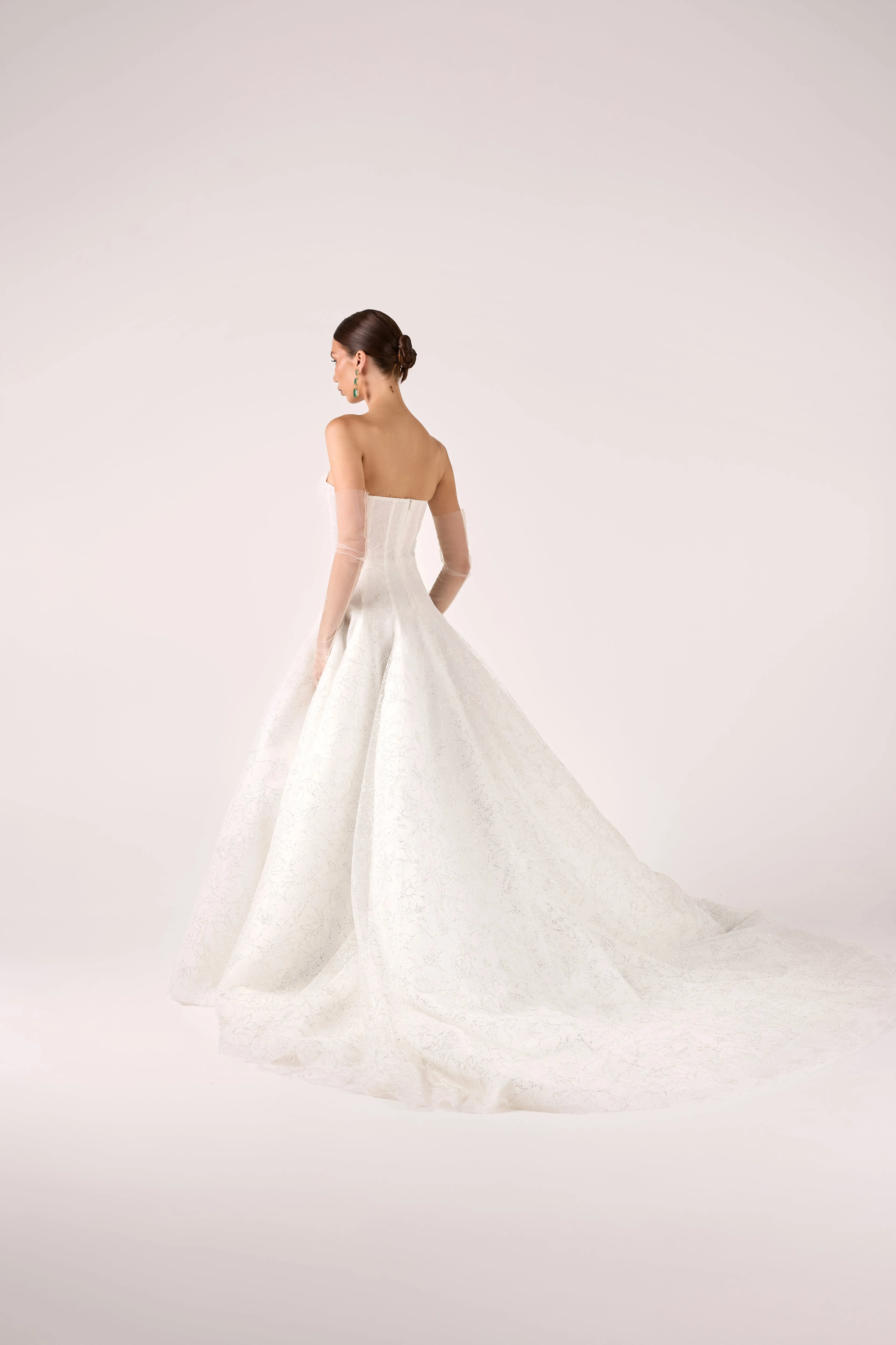 Timeless Strapless Glitter Tulle Ball Gown with Subtle Floral Pattern