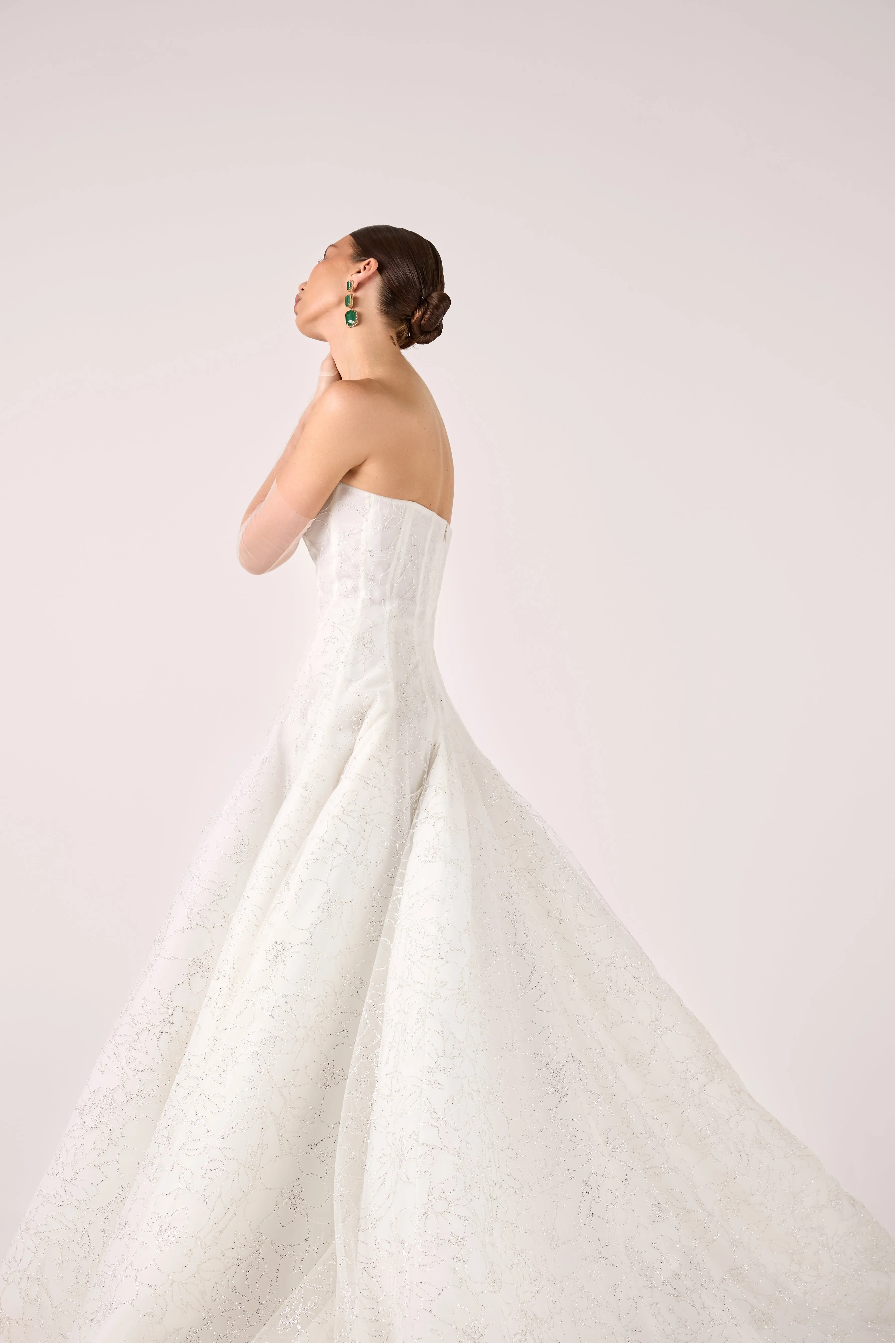 Timeless Strapless Glitter Tulle Ball Gown with Subtle Floral Pattern